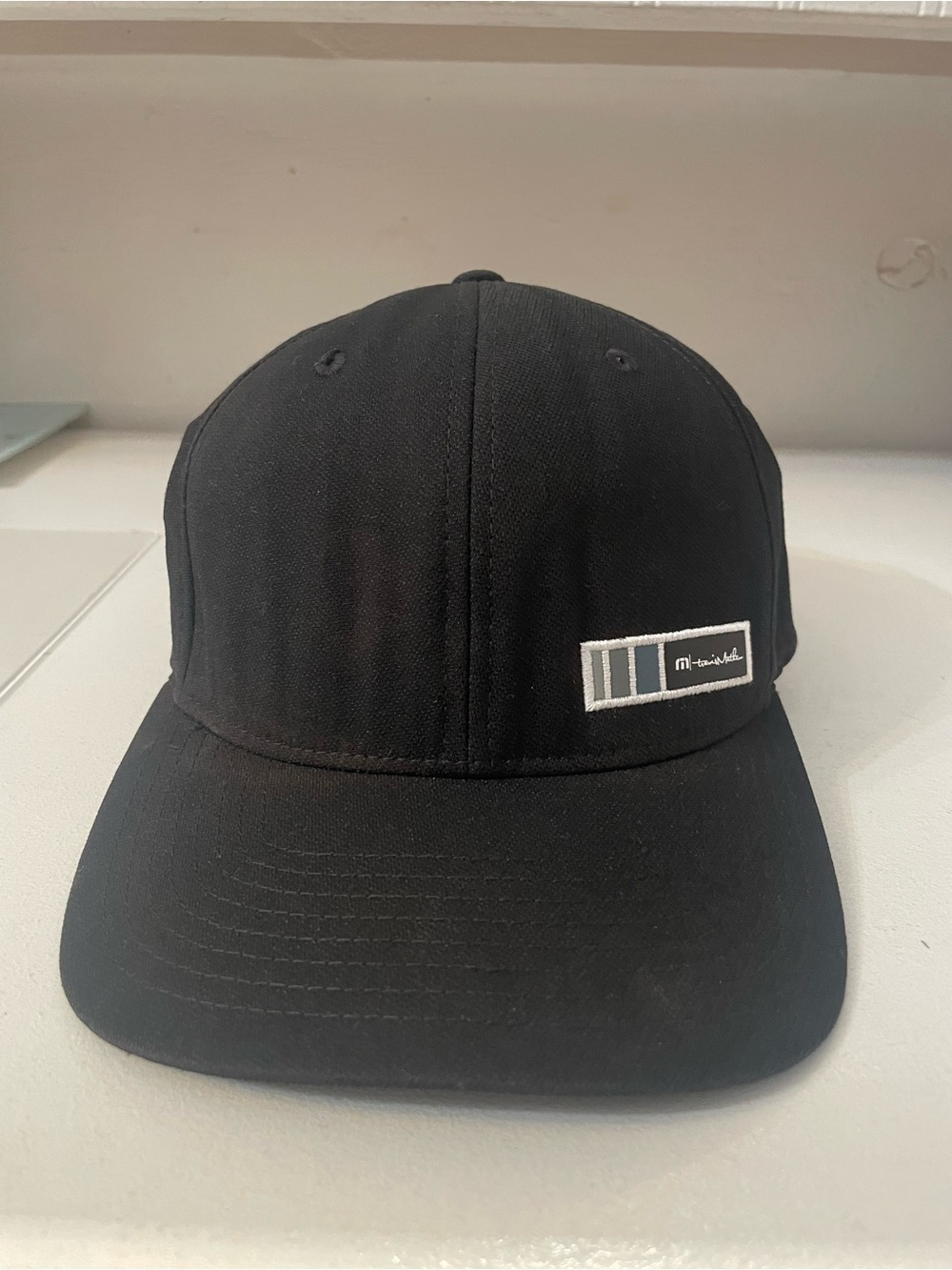 Travis Mathew Black flex fit Cap with Subtle Stripe Patch Sz L/XL